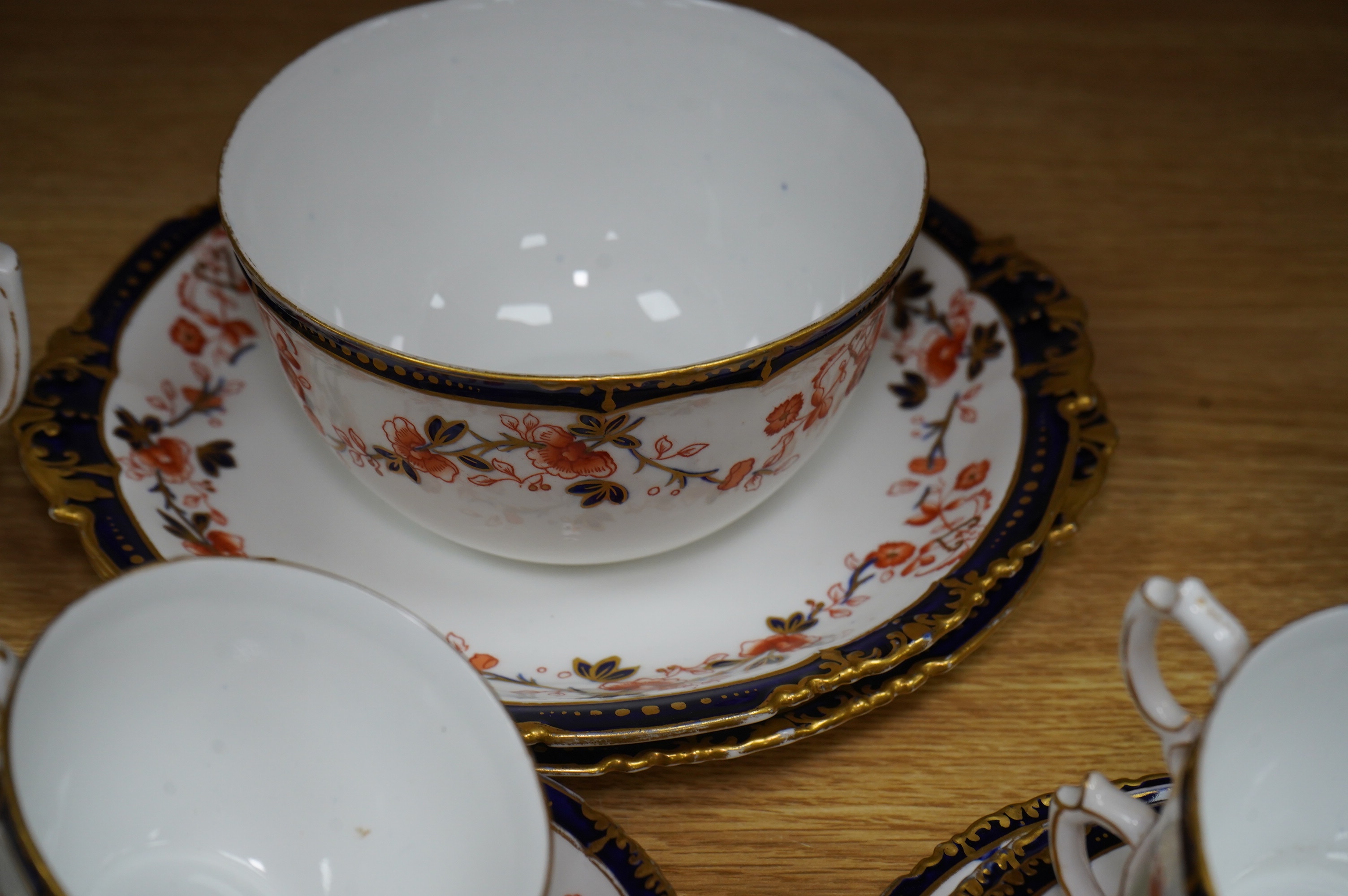 A Royal Crown Derby Imari porcelain part tea set to include sandwich plates, trios and milk jug. Condition - varies, some breaks